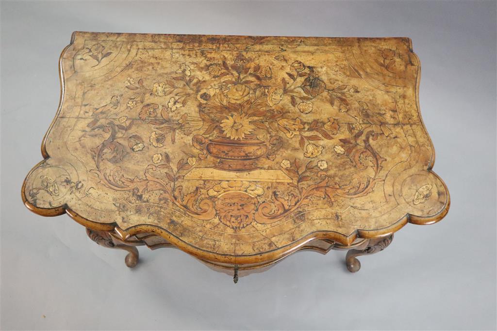 An 18th century Dutch and walnut marquetry lowboy, W.2ft 9in. D.1ft 8in. H.2ft 5in.